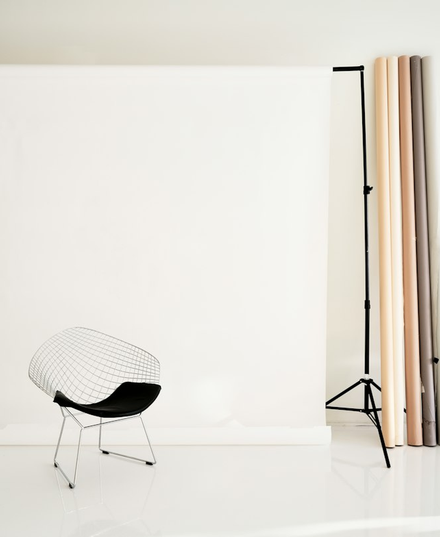Photo corner with a printed backdrop and two LED panels at an evening event
